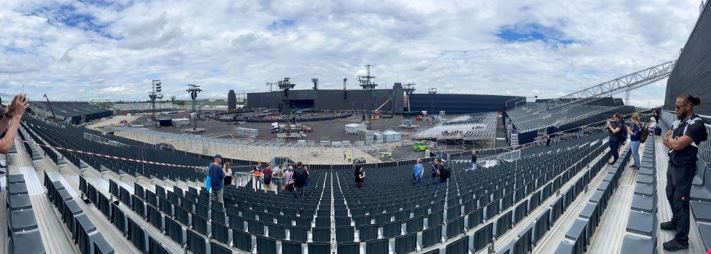 A wide shot of Adele's concert venue in Munich, showing the scale of the stage and a panoramic view of the seating