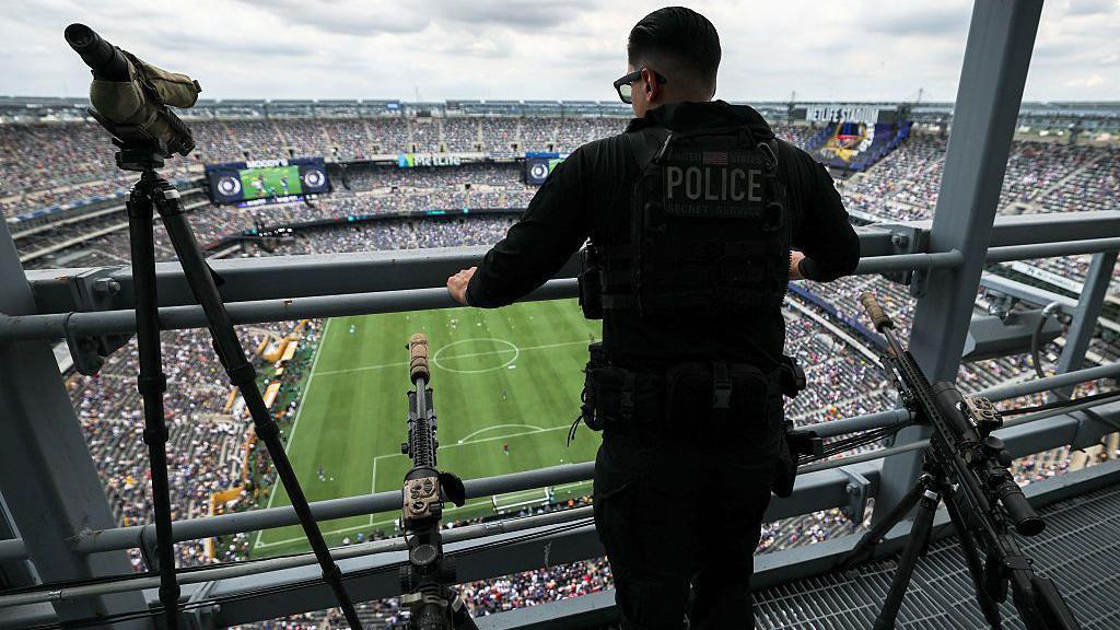 A US Secret Service sniper stands guard ahead of the Club World Cup final between Chelsea and Paris St-Germain