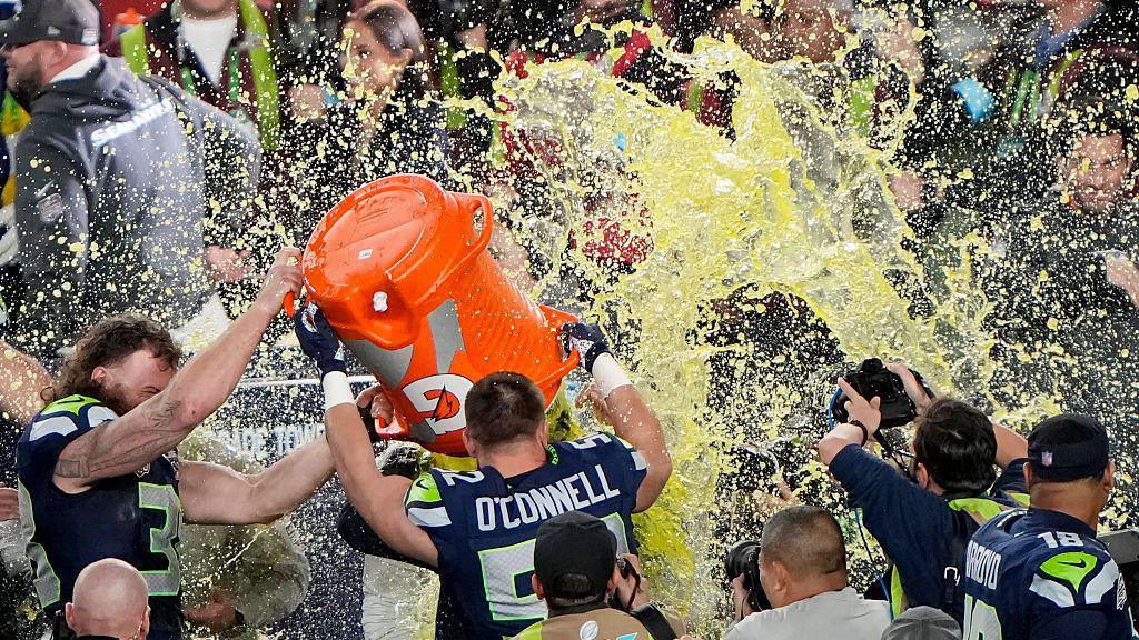 Mike MacDonald getting soaked with Gatorade