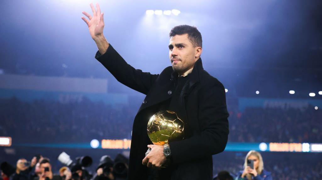 Rodri with the Ballon d'Or trophy