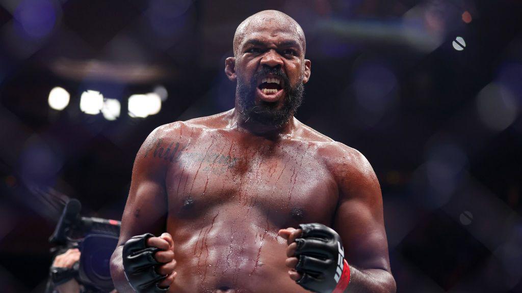 Jon Jones celebrates after beating Stipe Miocic in November 2024