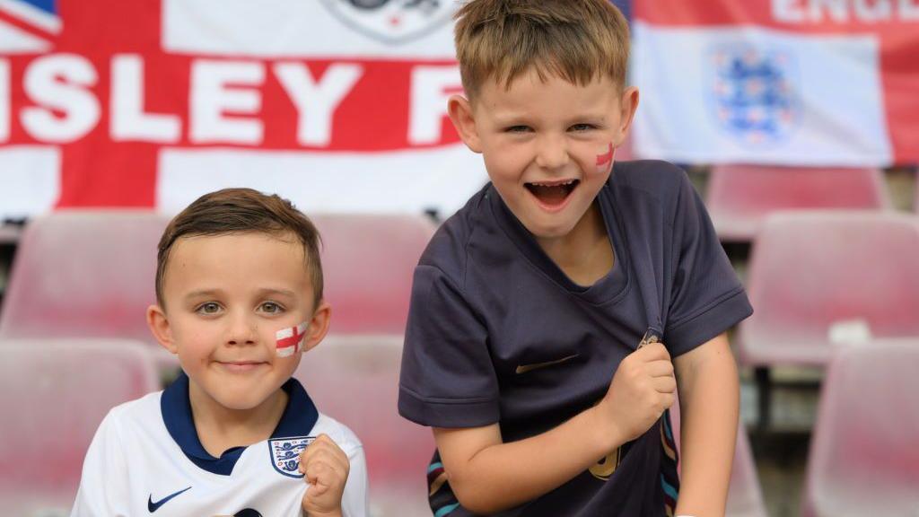 two boys celebrating england