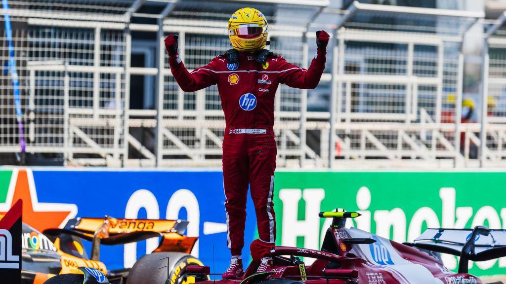 Lewis Hamilton celebrates winning the sprint race in China