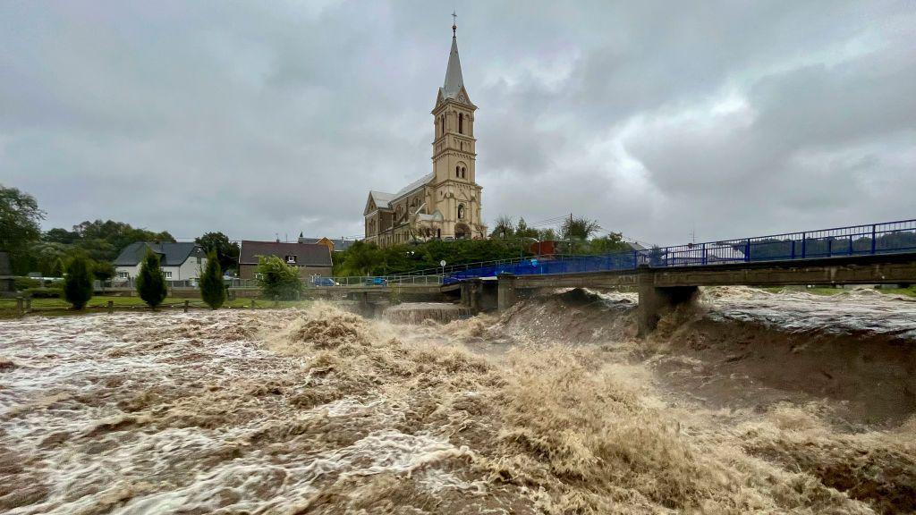 A torrent of water flows along the river Bela in the Czech Republic