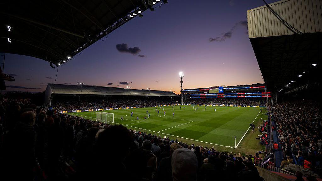 An image of Crystal Palace's Selhurst Park at sunset