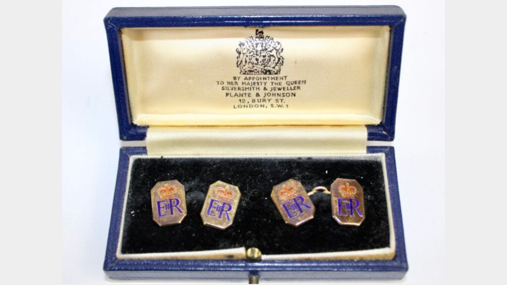 A pair of 9ct gold and enamel octagonal cufflinks with crowned ERII ciphers presented by Queen Elizabeth II to Squadron Leader Denis Lowery.