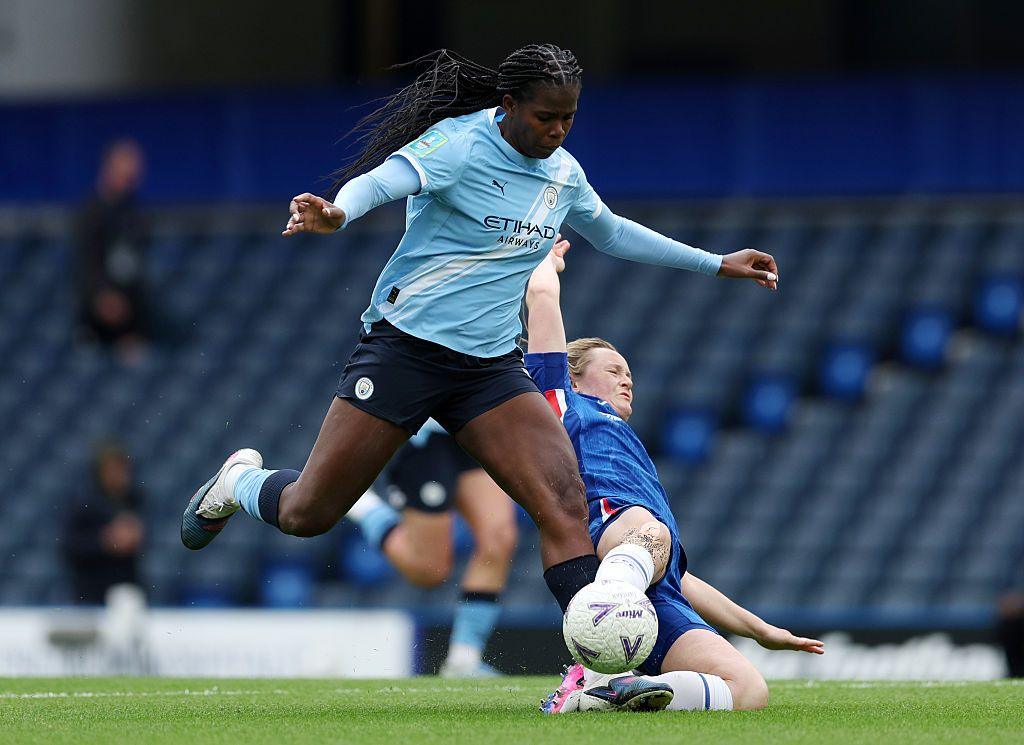 Khadija Shaw of Manchester City is challenged by Erin Cuthbert of Chelsea during the Adobe Women's FA Cup Semi Final match between Chelsea and Manchester City at Stamford Bridge 