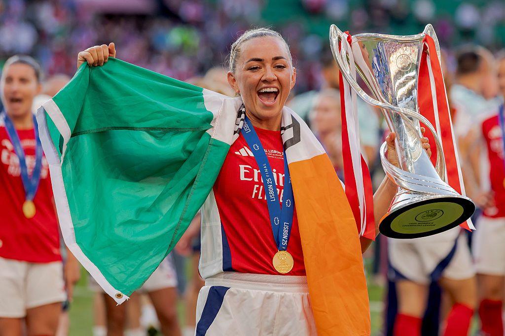 Katie McCabe with an Ireland flag and the Champions League trophy