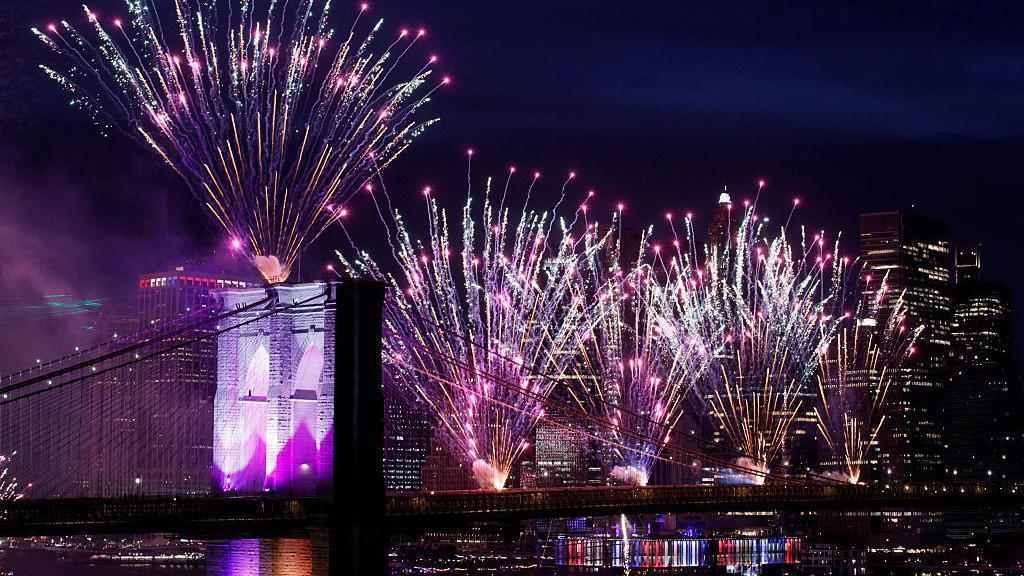 Fireworks light up the Brooklyn Bridge during the Macy's Fourth of July celebration in New York City.