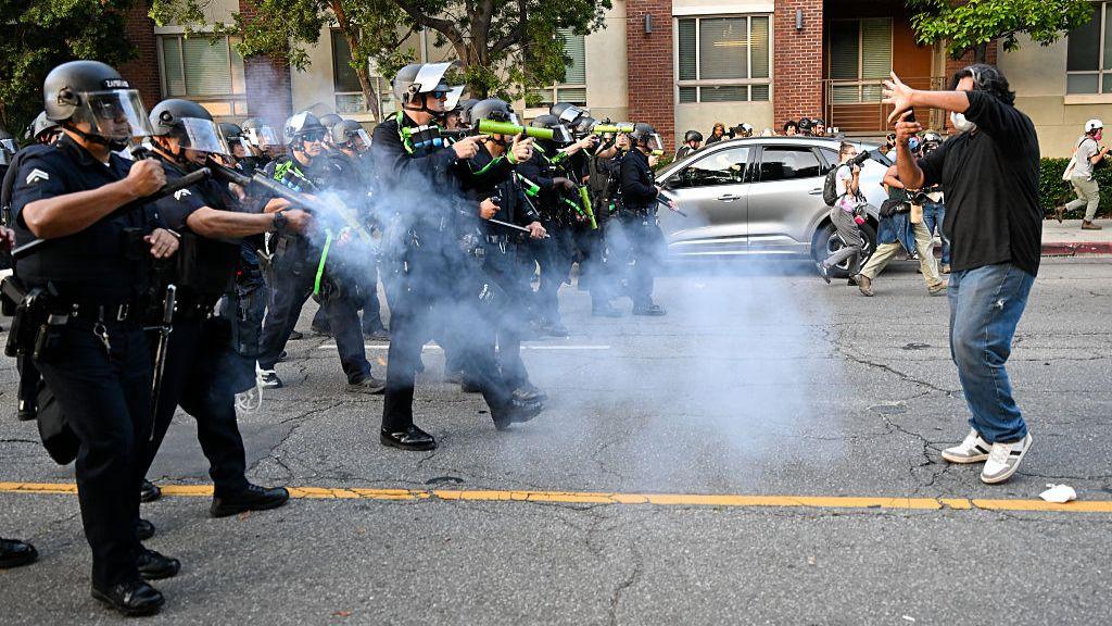  Anti-ICE protesters clash with police near the Federal Building and detention center in Los Angeles, California on June 9, 2025