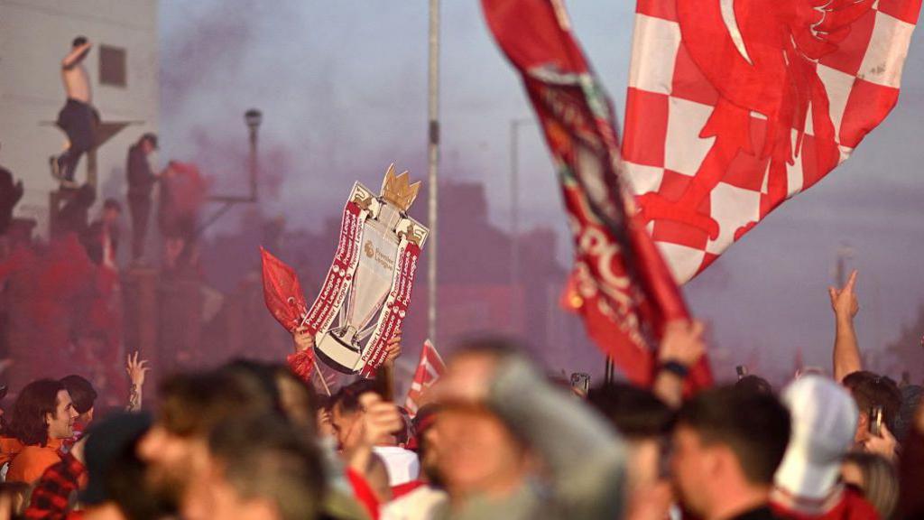 General view of Liverpool fans celebrating outside Anfield