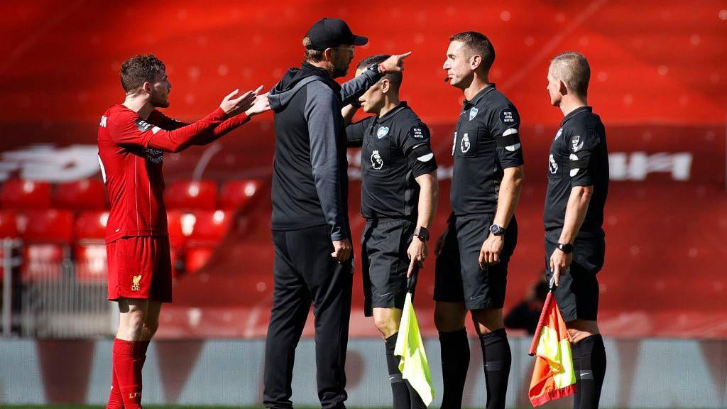 Jurgen Klopp remonstrates with the officials, including David Coote