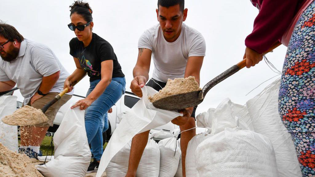 People making sandbags