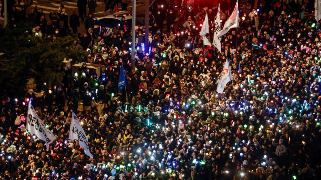 Protesters take part in a rally calling for the impeachment of South Korean President Yoon Suk Yeol, who declared martial law, which was reversed hours later, near the National Assembly in Seoul