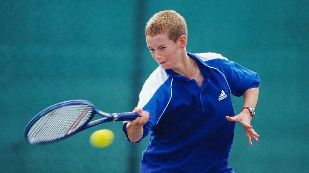 A young Andy Murray playing tennis 