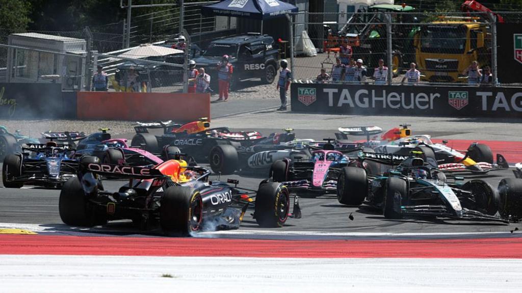 Red Bull's Max Verstappen is spun round and damaged after being hit by Mercedes' Kimi Antonelli