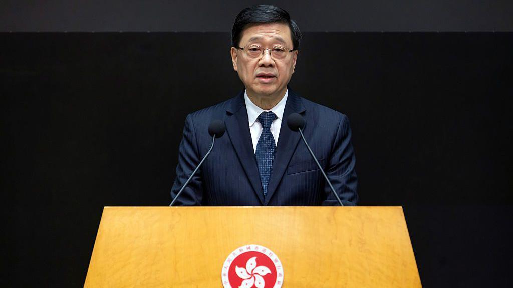John Lee, Hong Kong's chief executive, speaks during a news conference in Hong Kong on 2 December 2025.