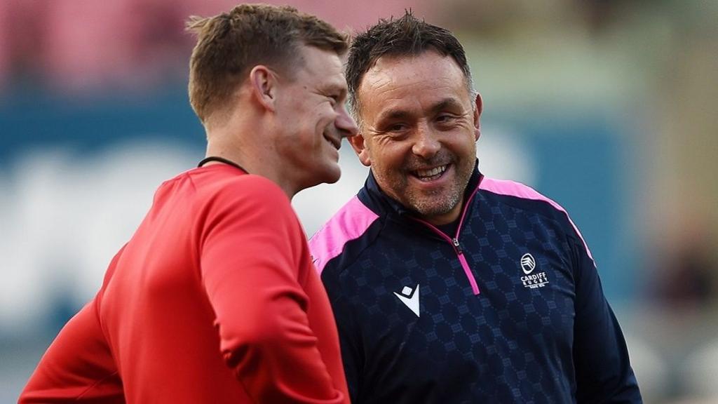 Scarlets boss Dwayne Peel (L) and Cardiff counterpart Matt Sherratt share a joke