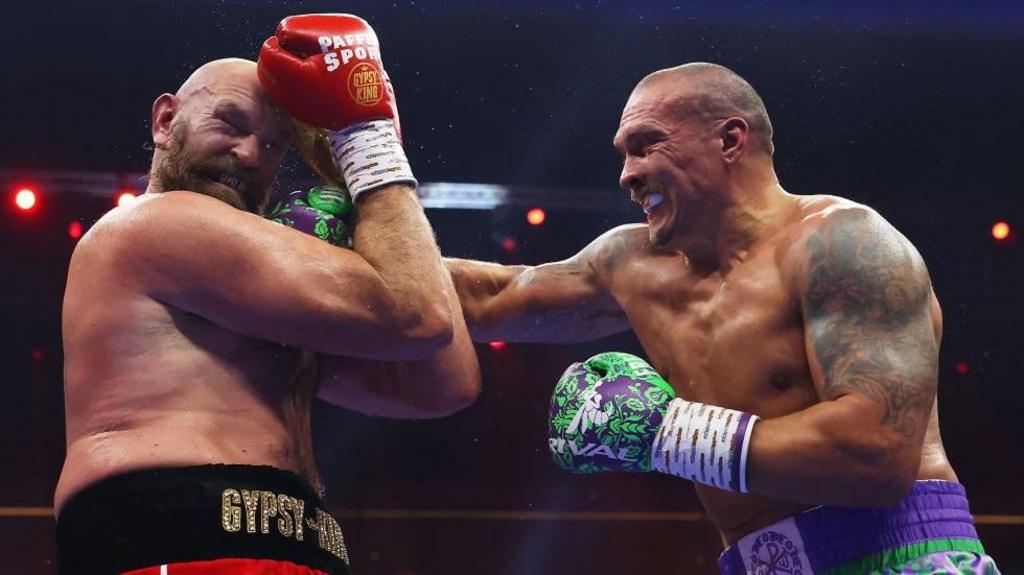 Oleksandr Usyk punches Tyson Fury in a fight