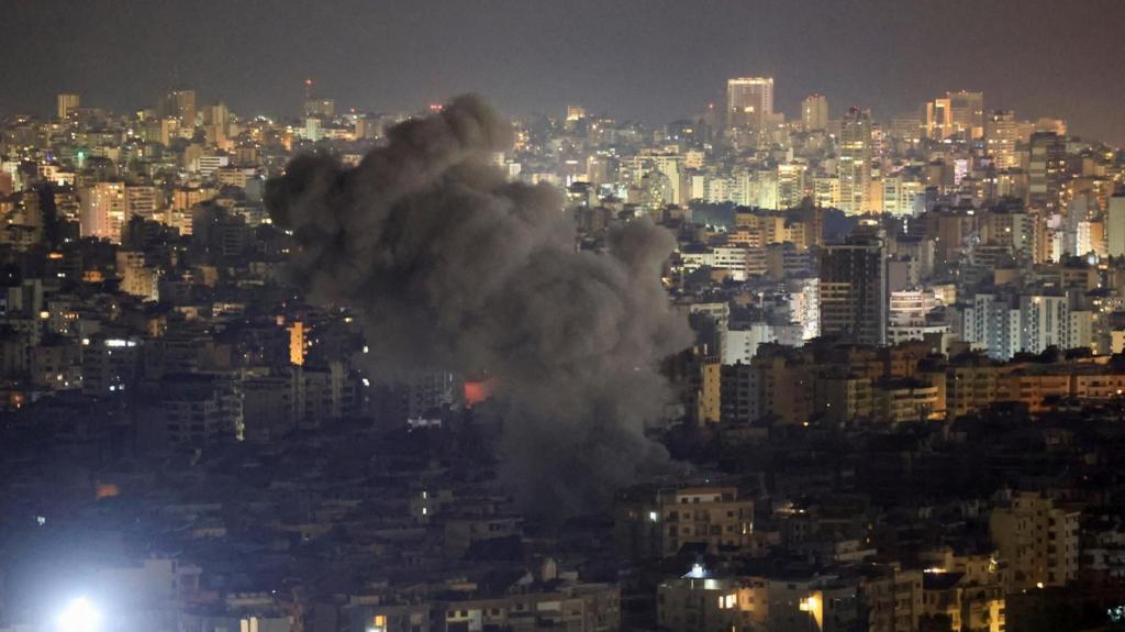 Smoke rises from a cityscape of Beirut, Lebanon.