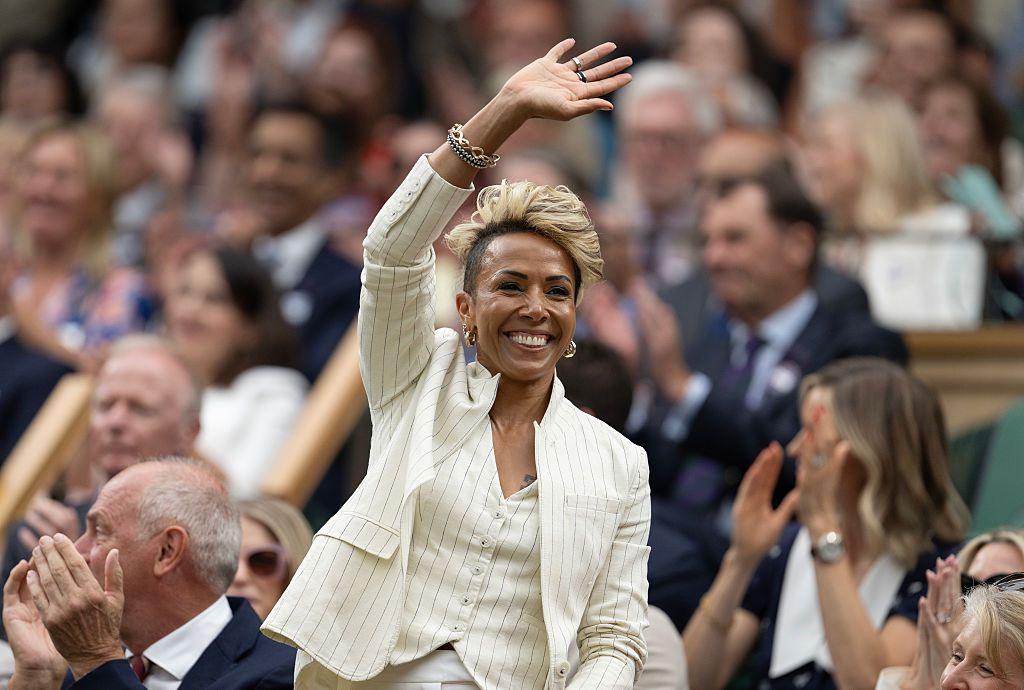 Kelly Holmes waves to the crowd from the Wimbledon Centre Court royal box
