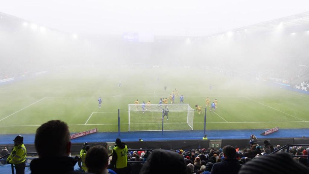 General shot of the game in thick fog