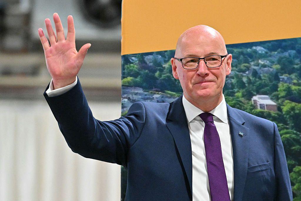 John Swinney waving