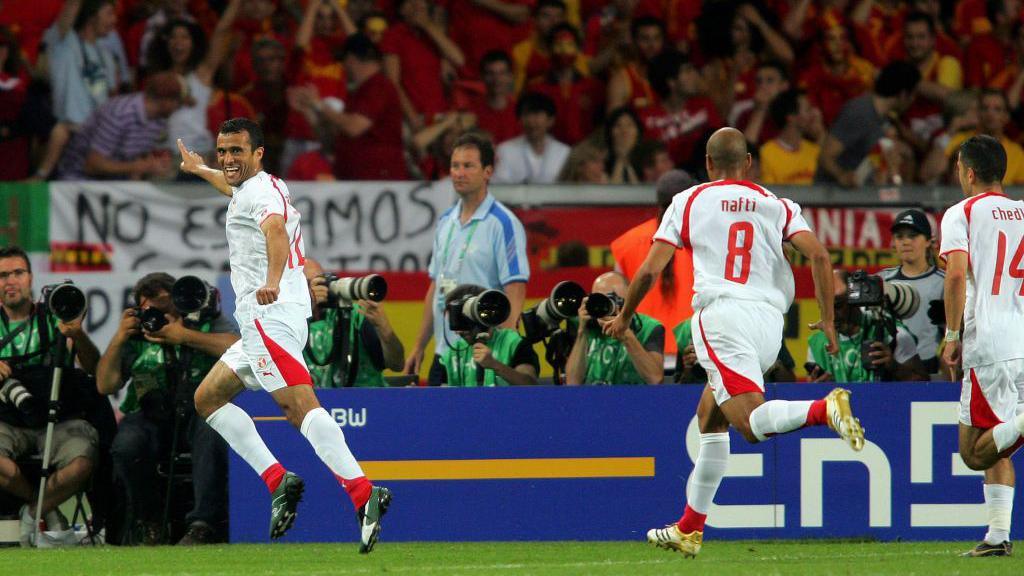 Image of Jaouhar Mnari of Tunisia celebrating during the FIFA World Cup Finals 2006 Group H match between Spain and Tunisia after opening goal.