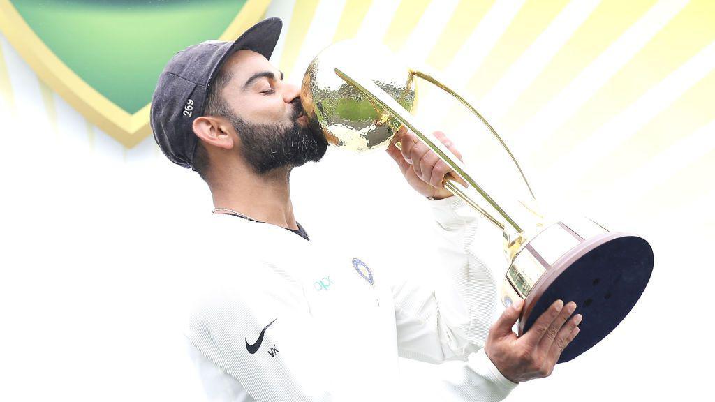 Virat Kohli of India kisses the Border–Gavaskar Trophy as he celebrates India's 2-1 series win after day five of the Fourth Test match in the series between Australia and India at Sydney Cricket Ground on January 07, 2019 in Sydney, Australia.