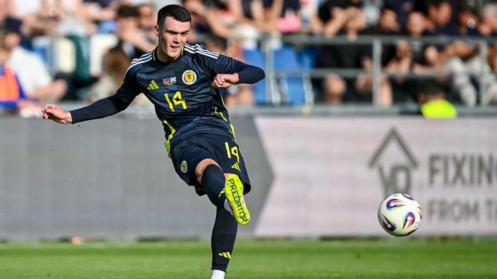 Lennon Miller plays a pass forward during Scotland's win over Liechtenstein