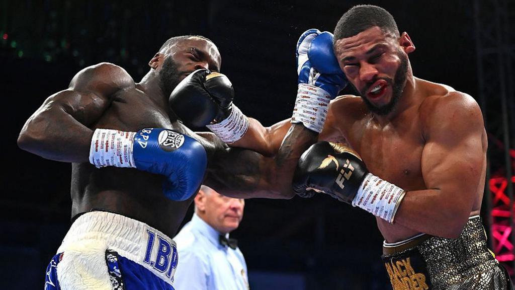 Caoimhin Agyarko with a swollen right eye in action against Ishmael Davis
