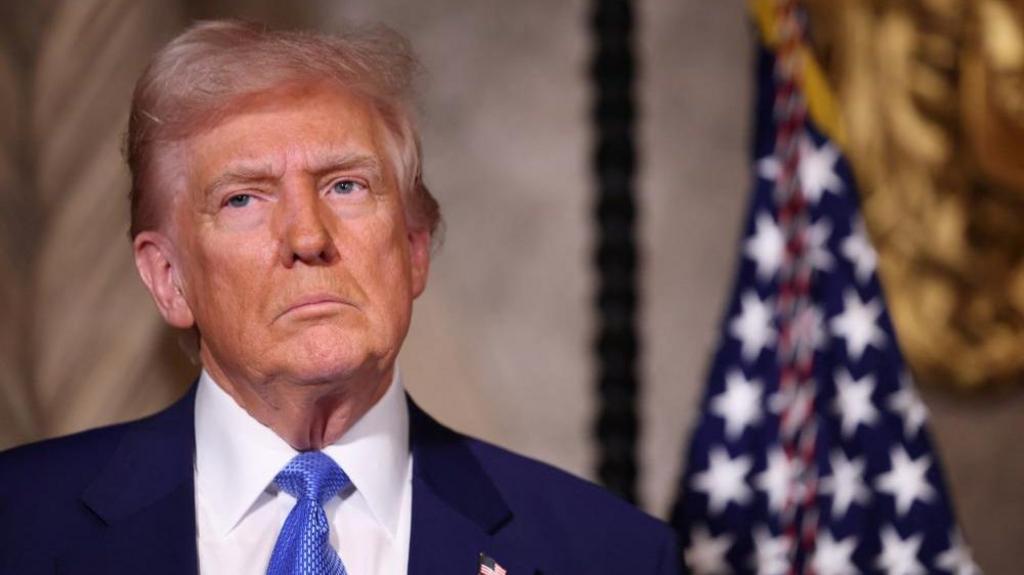 US President Donald Trump looks on at Mar-a-Lago in Palm Beach, Florida