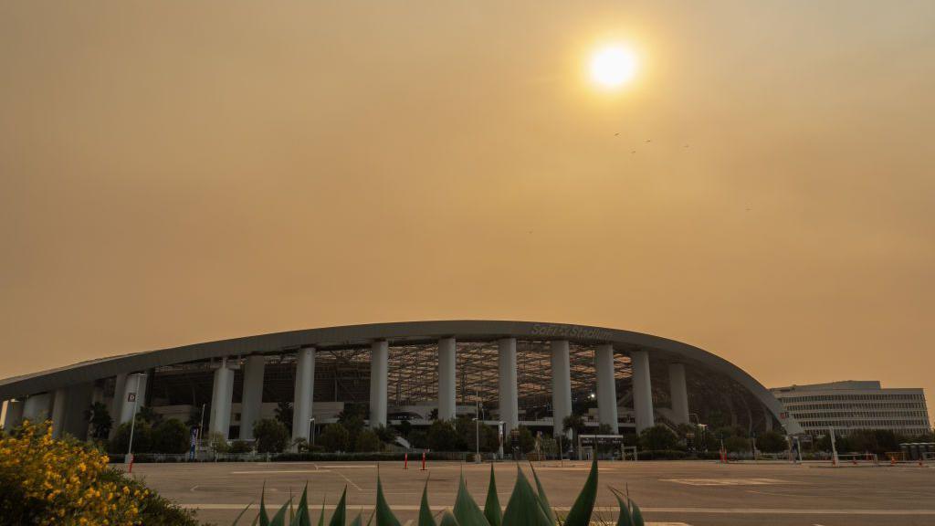 Smoke from the recent fires obscures the sun at SoFi Stadium in Inglewood, CA on Thursday, Jan. 9, 2025