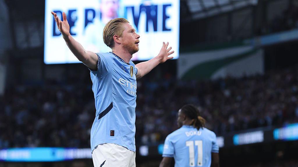 Kevin De Bruyne celebrating after scoring against Wolves.