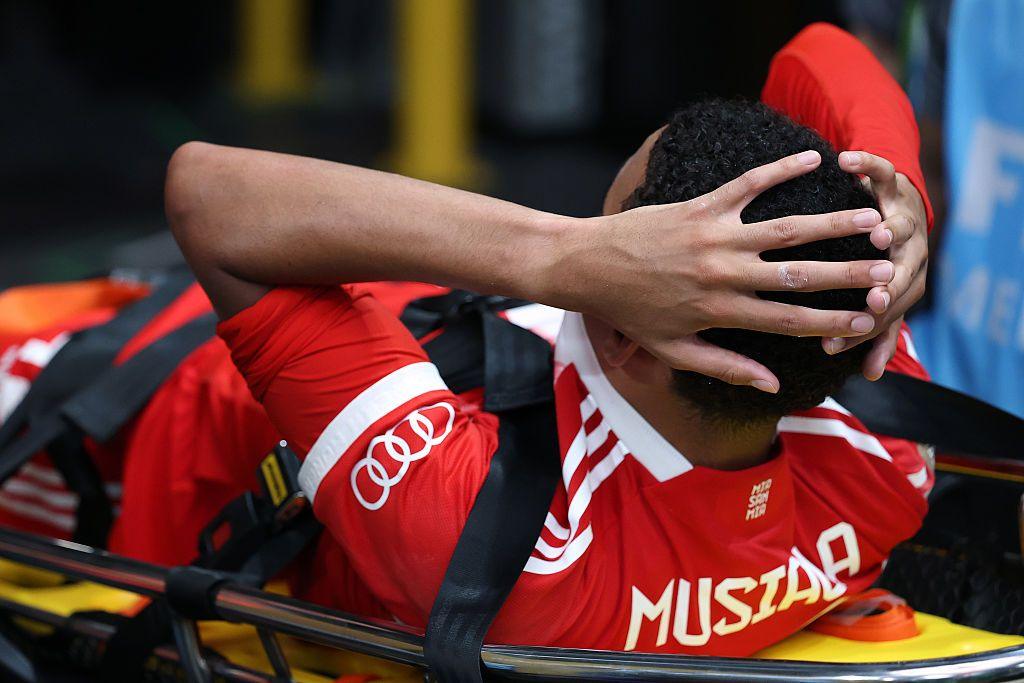 Jamal Musiala is carted from the pitch by medical staff following an injury during the FIFA Club World Cup.