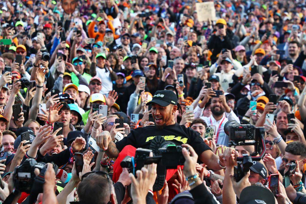 Lewis Hamilton crowd-surfs after winning the 2024 British Grand Prix