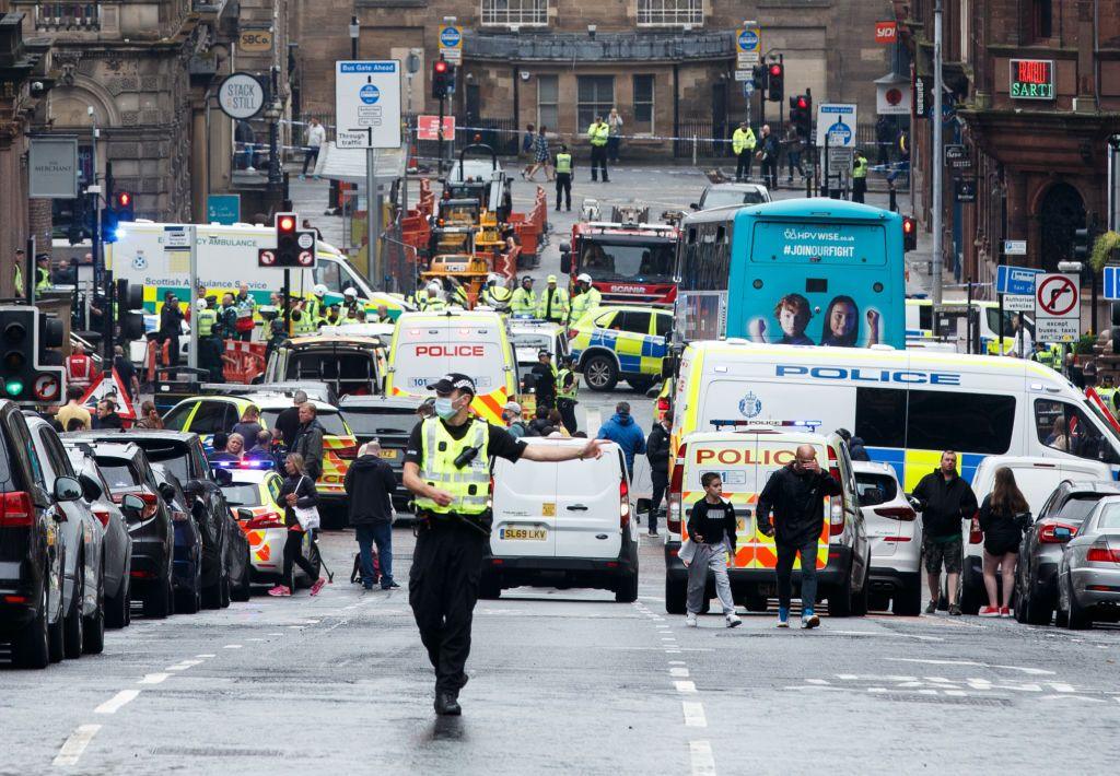 Looking down St Vincent Street in Glasgow city centre - there is a large number of emergency vehicles blocking the road with an area outside the Park Inn hotel cordoned off