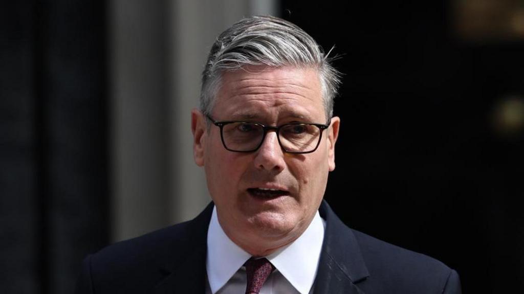 A head and shoulders picture of Keir Starmer speaking at Downing St