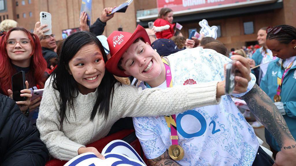 England World Cup winner Hannah Botterman and an England fan