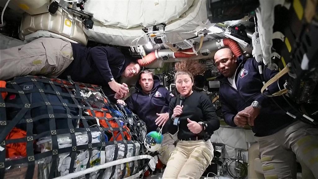 Artemis II crew floating in spacecraft