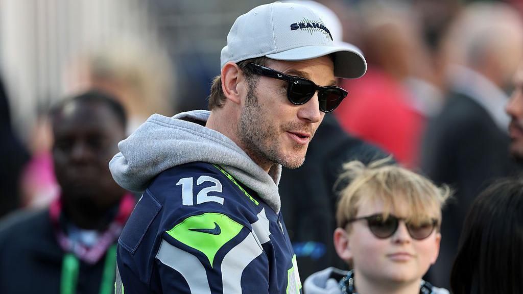 Chris Pratt wearing sunglasses with his son