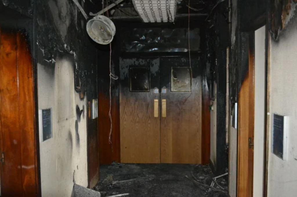 Some of the damage to the first floor corridor after the fire