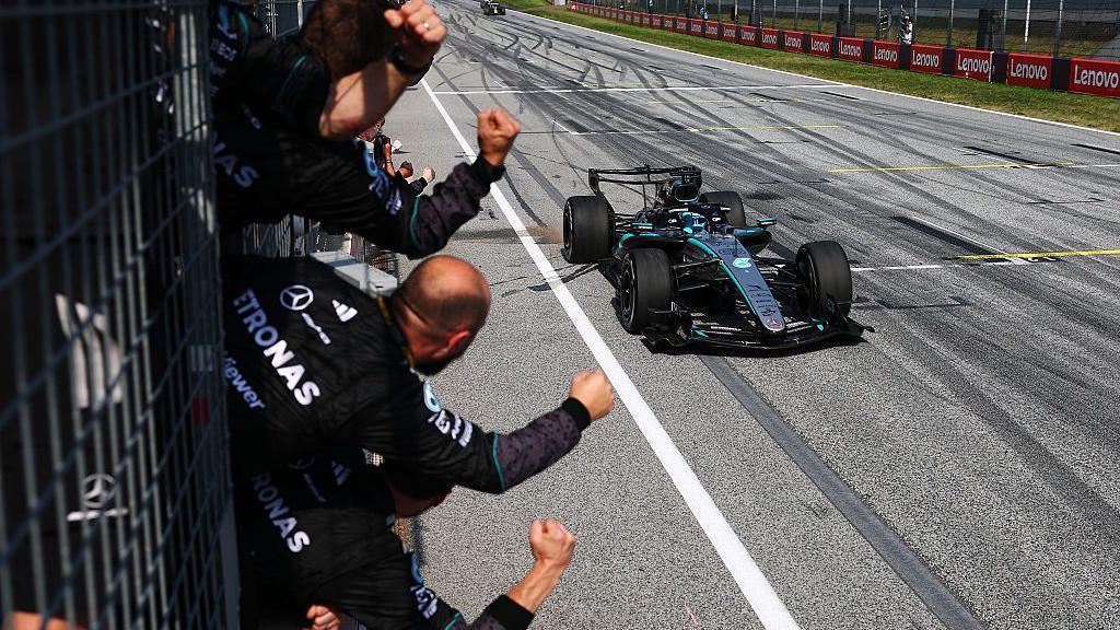 Mercedes crew celebrates George Russell's victory