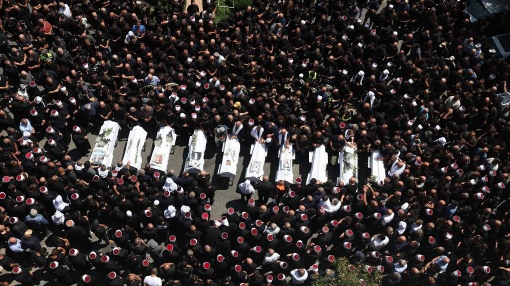 Relatives attend funeral of victims in Majdal Shams, after missile attack from Lebanon