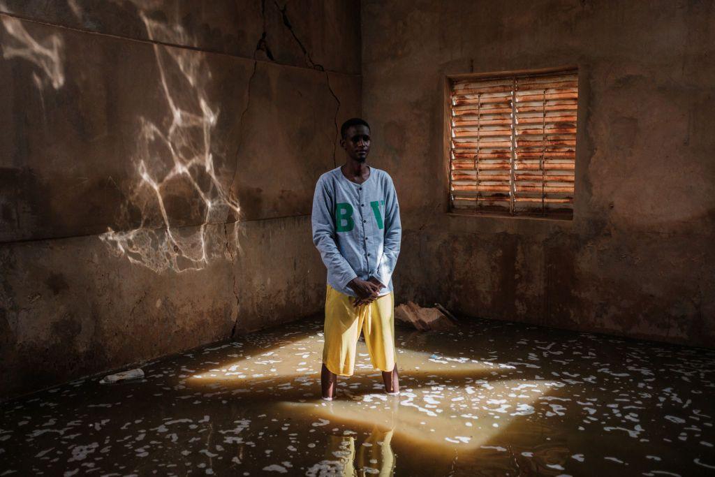 Teacher Suleyman Ba stands in a classroom of the Ecole de Diogel with water marks from flooding less then a week before and water still ankle deep in class rooms and waste deep in the court yard in Dioguel on October 22, 2024. Floods along the Senegal river have affected over 55,000 people after heavy rain in the Senegal River Basin leaving many villages underwater and over 1,000 hectares of farm land submerged. 