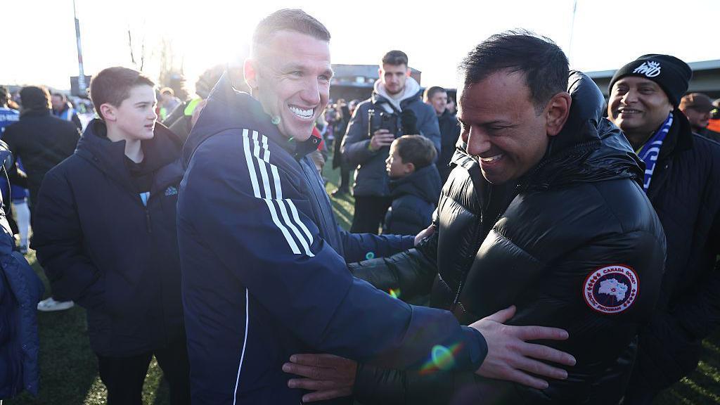 john rooney being congratulated by fans