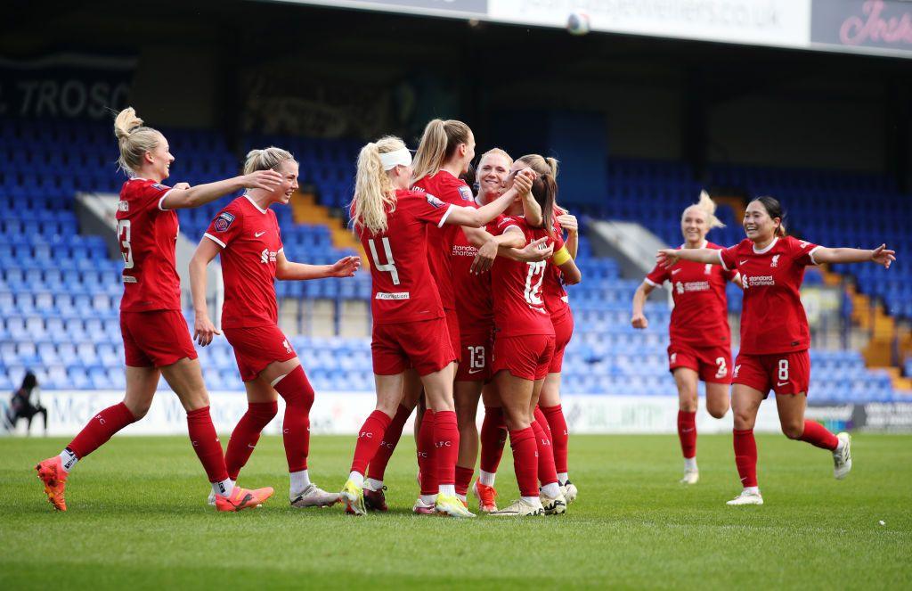 Liverpool celebrate after scoring against Manchester United