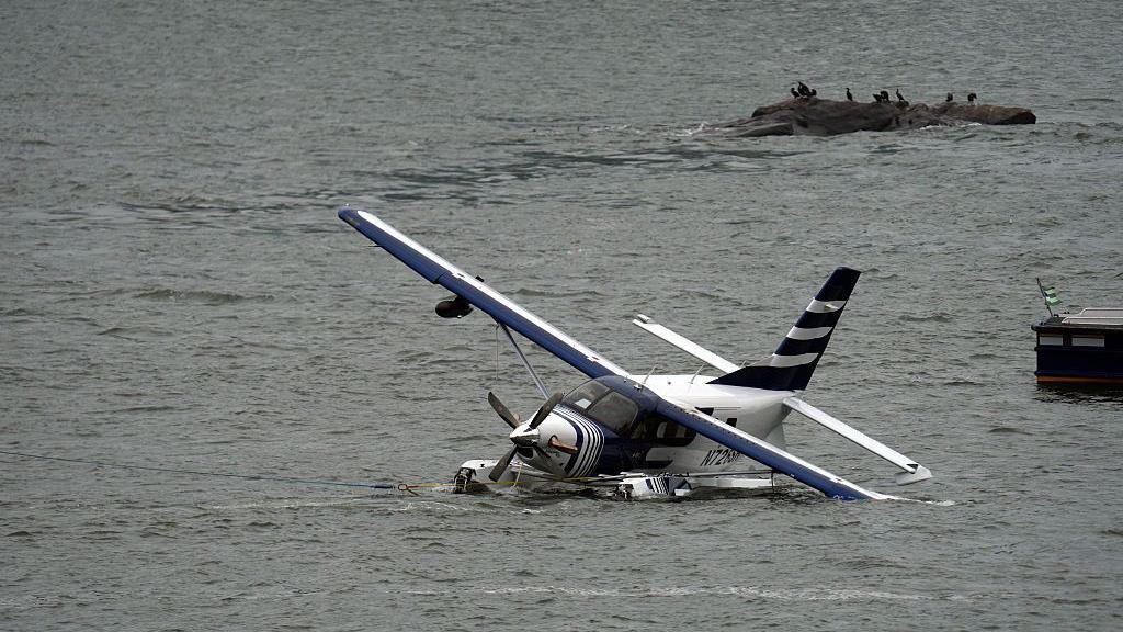 Emergency services respond to a crashed seaplane in the East River on 5 July in New York. 

