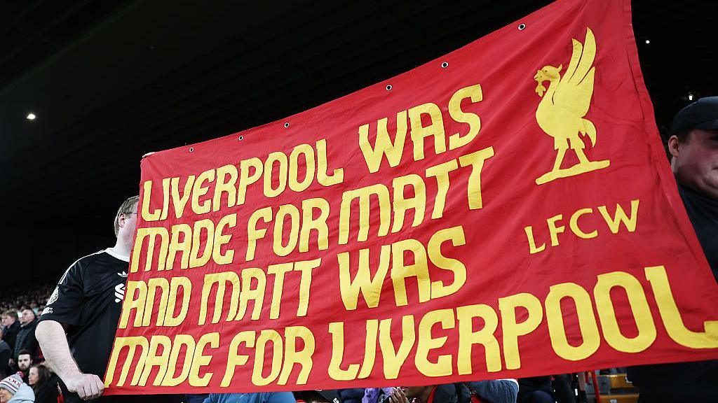 A banner in tribute of Matt Beard held up by supporters at Anfield