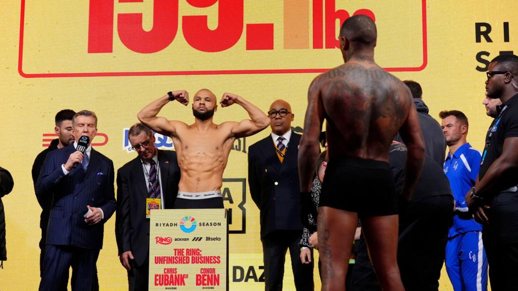 Conor Benn watches Chris Eubank Jr weigh in